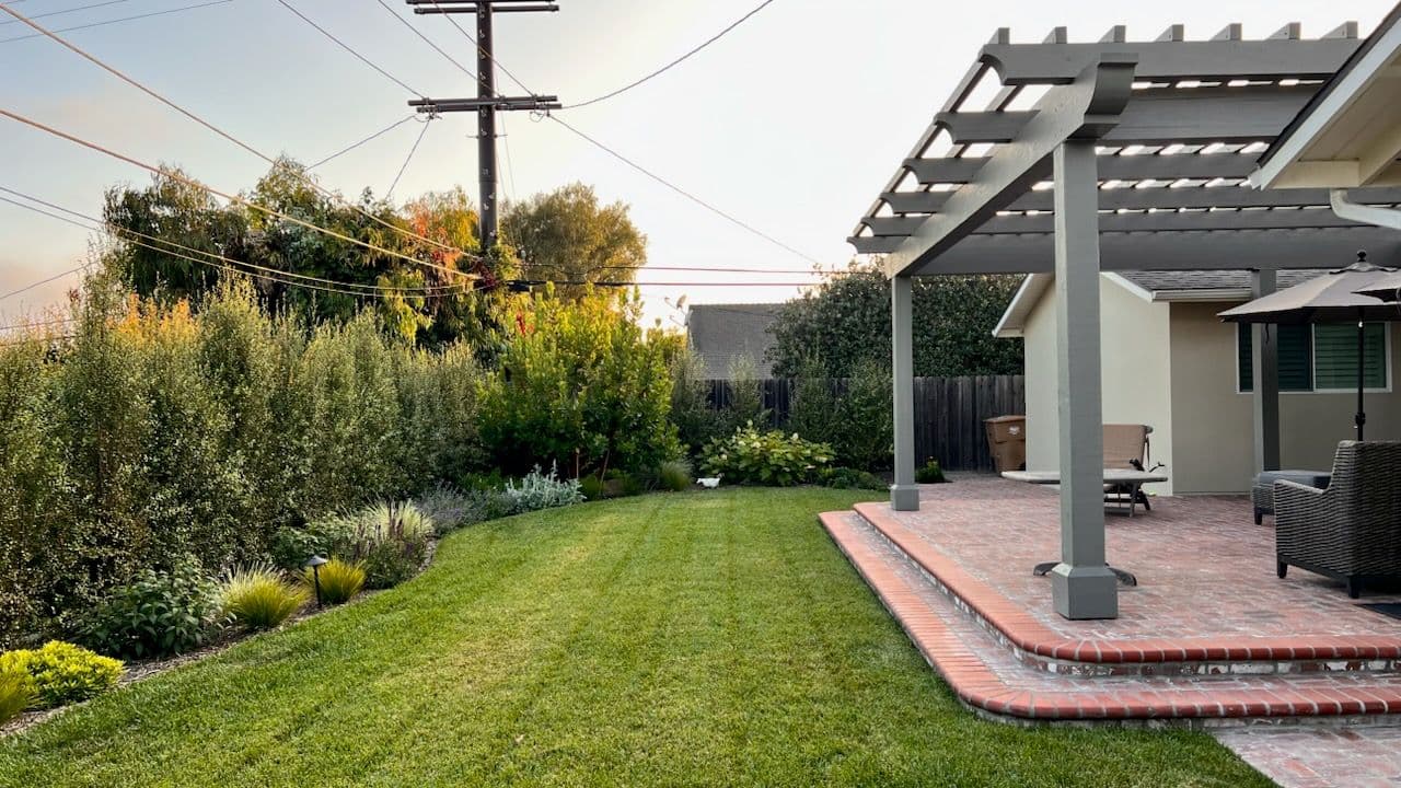 Stunning Backyard with Pergola and Brick Patio image