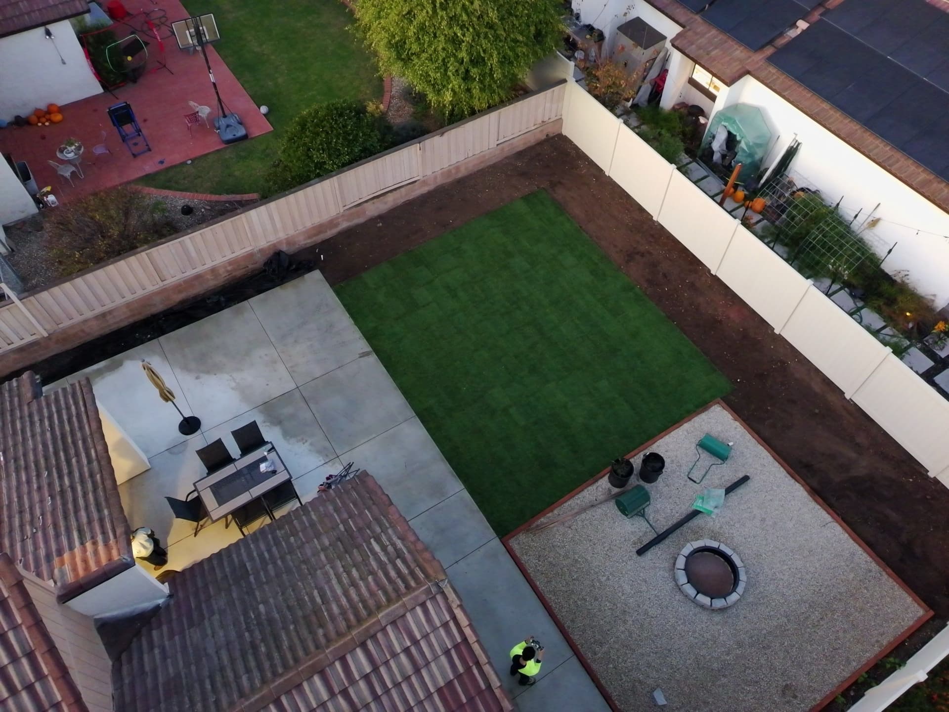 Backyard Makeover with New Grass and Fire Pit image