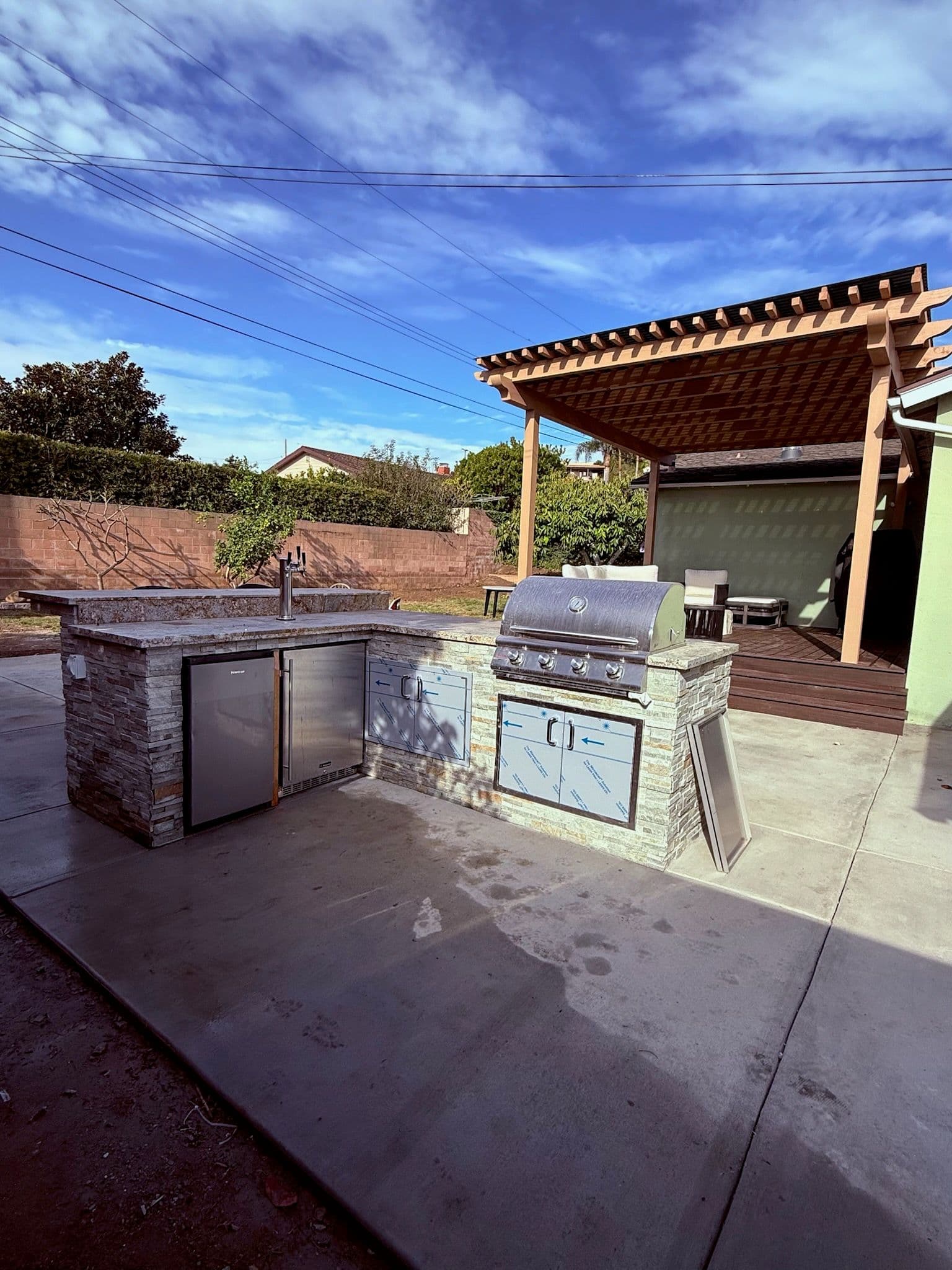 Stunning Outdoor Kitchen and Pergola Installation image