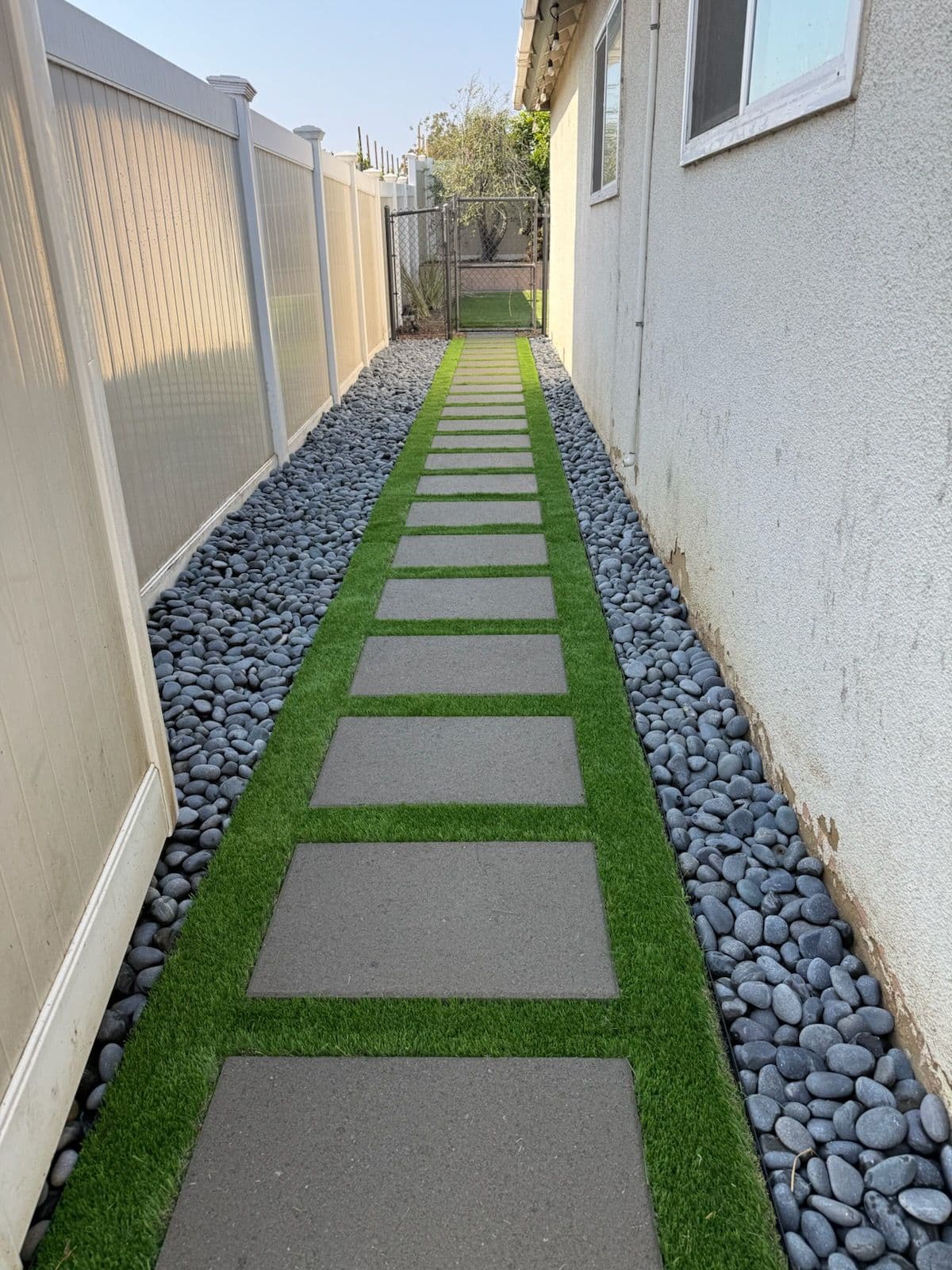 Side Yard Transformation with Concrete and Turf image